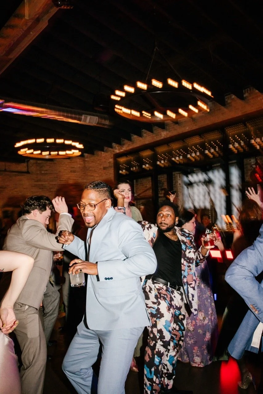 Wedding guests dancing on dance floor