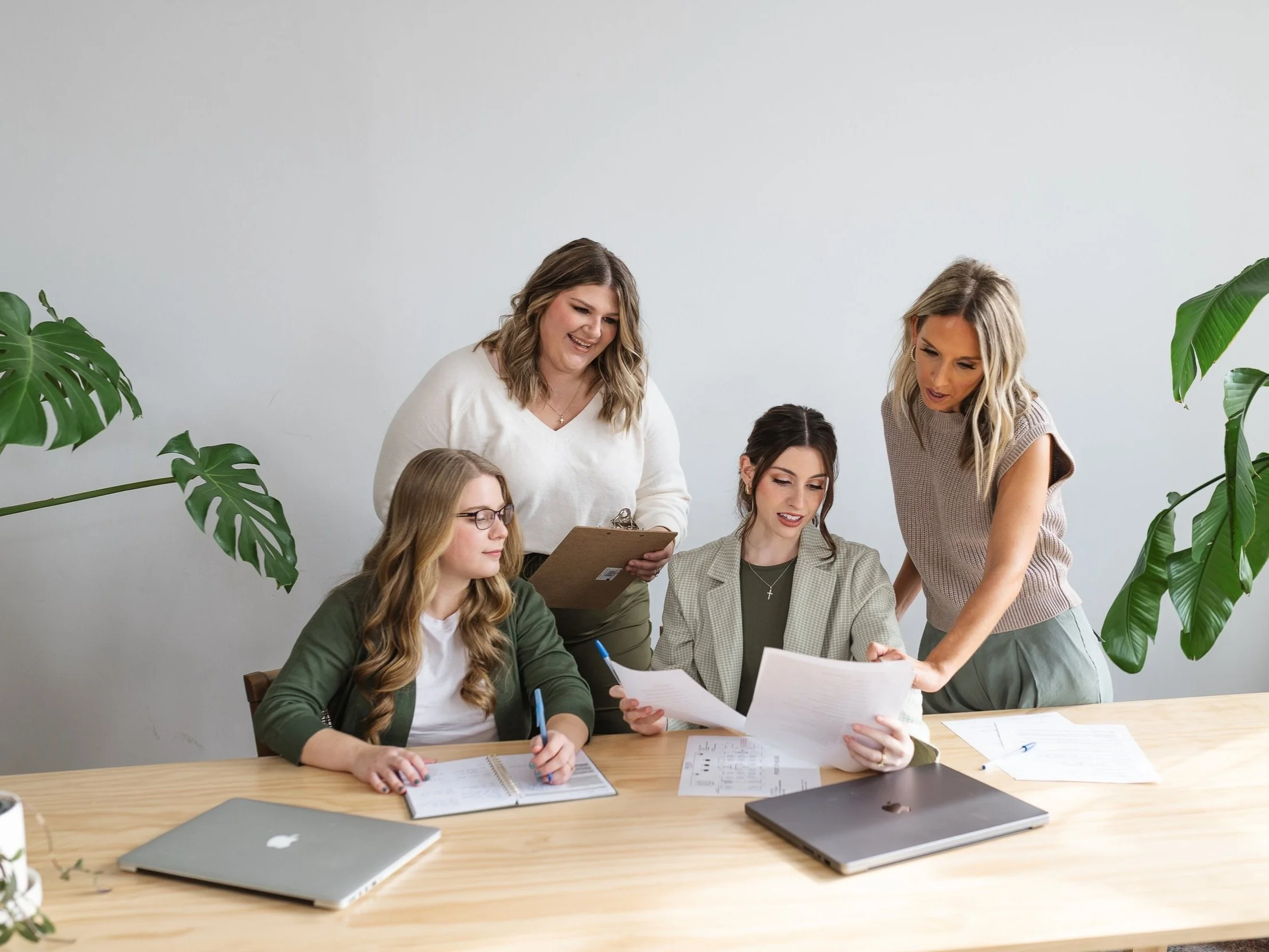 4 coordinators looking at timeline for Chicago wedding