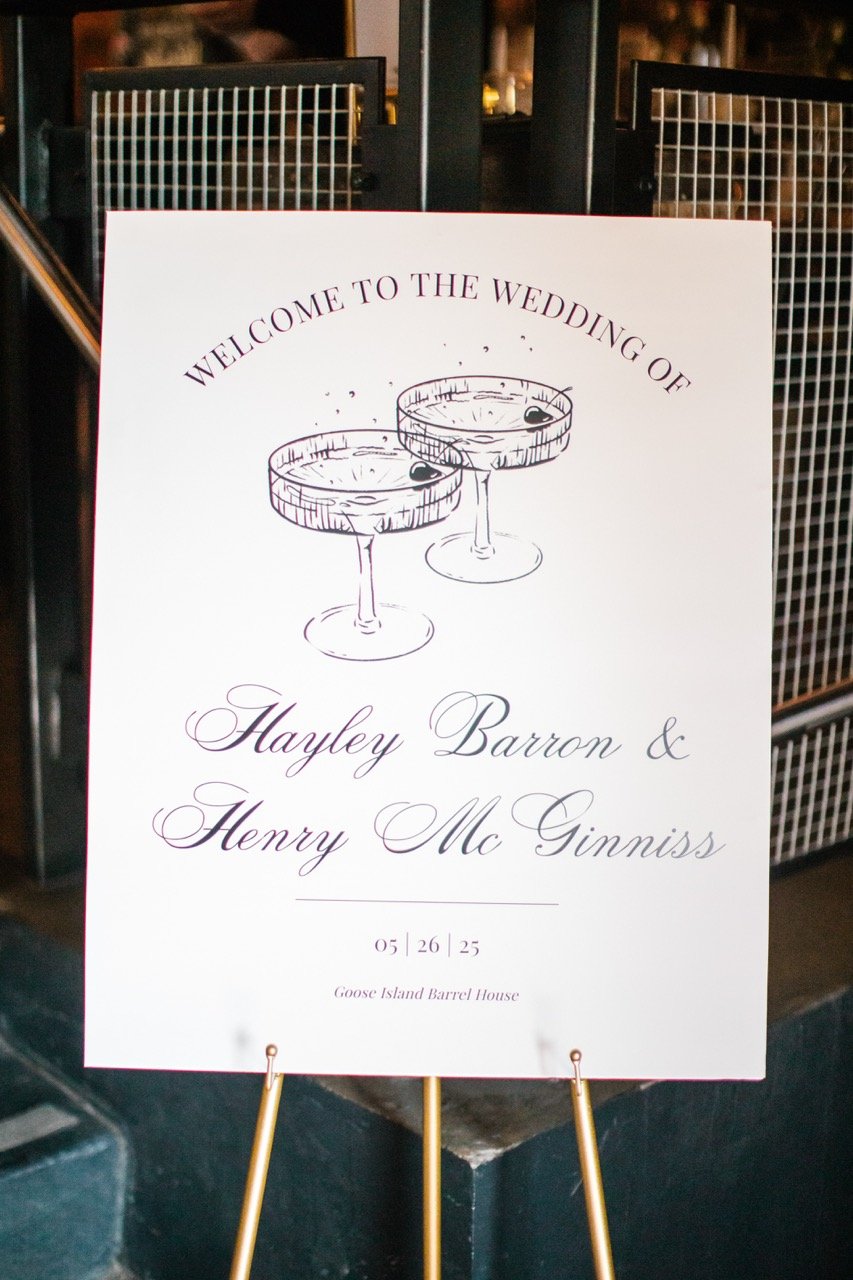 Welcome sign at Goose Island Barrel House in Chicago with two coupe glasses and script lettering