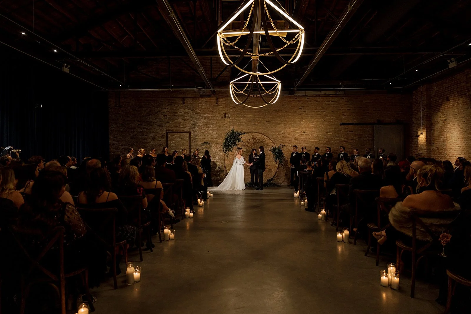 Bride and groom holding hands at wedding ceremony at Wildman BT in Chicago