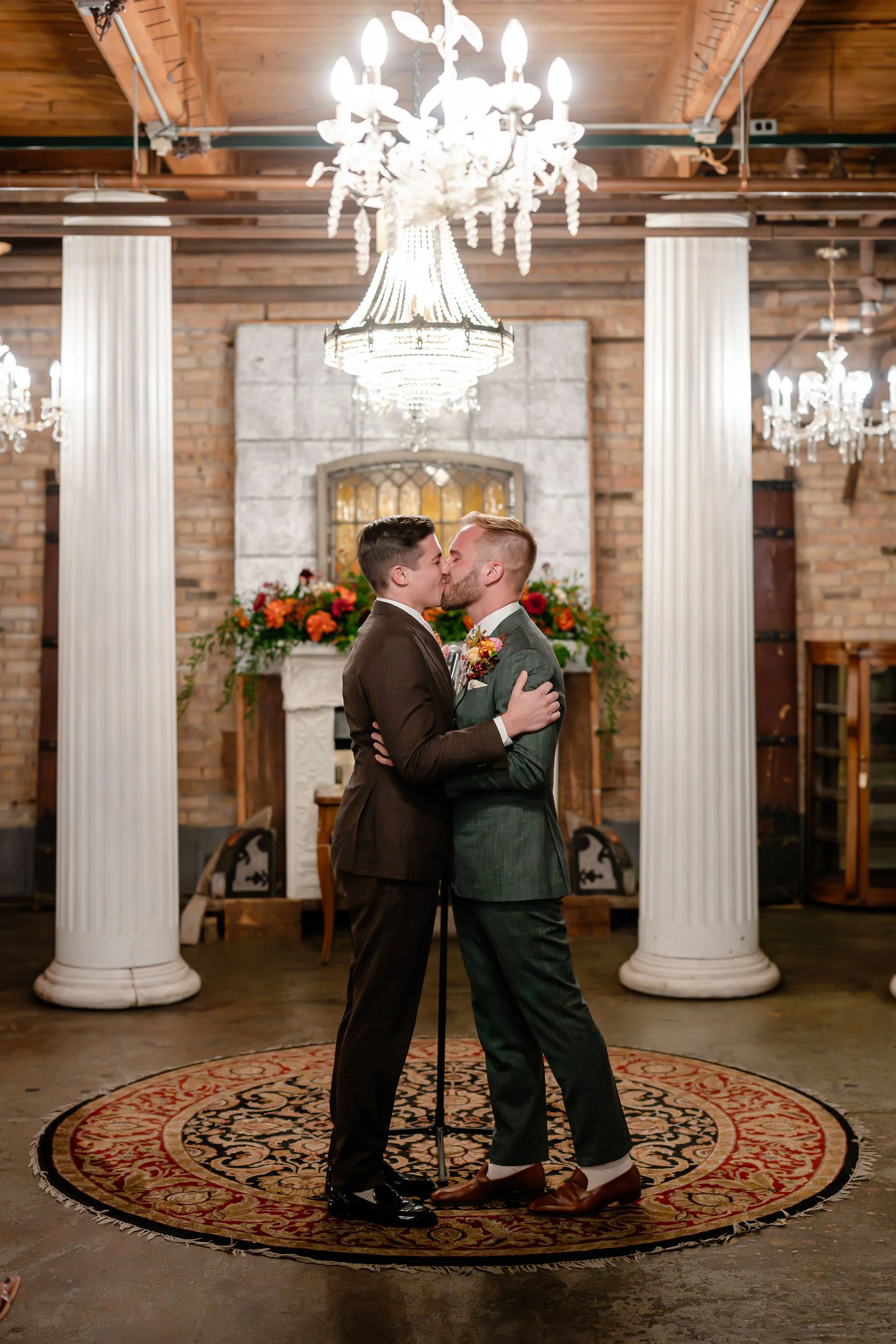 Two grooms first kiss after just being married at altar
