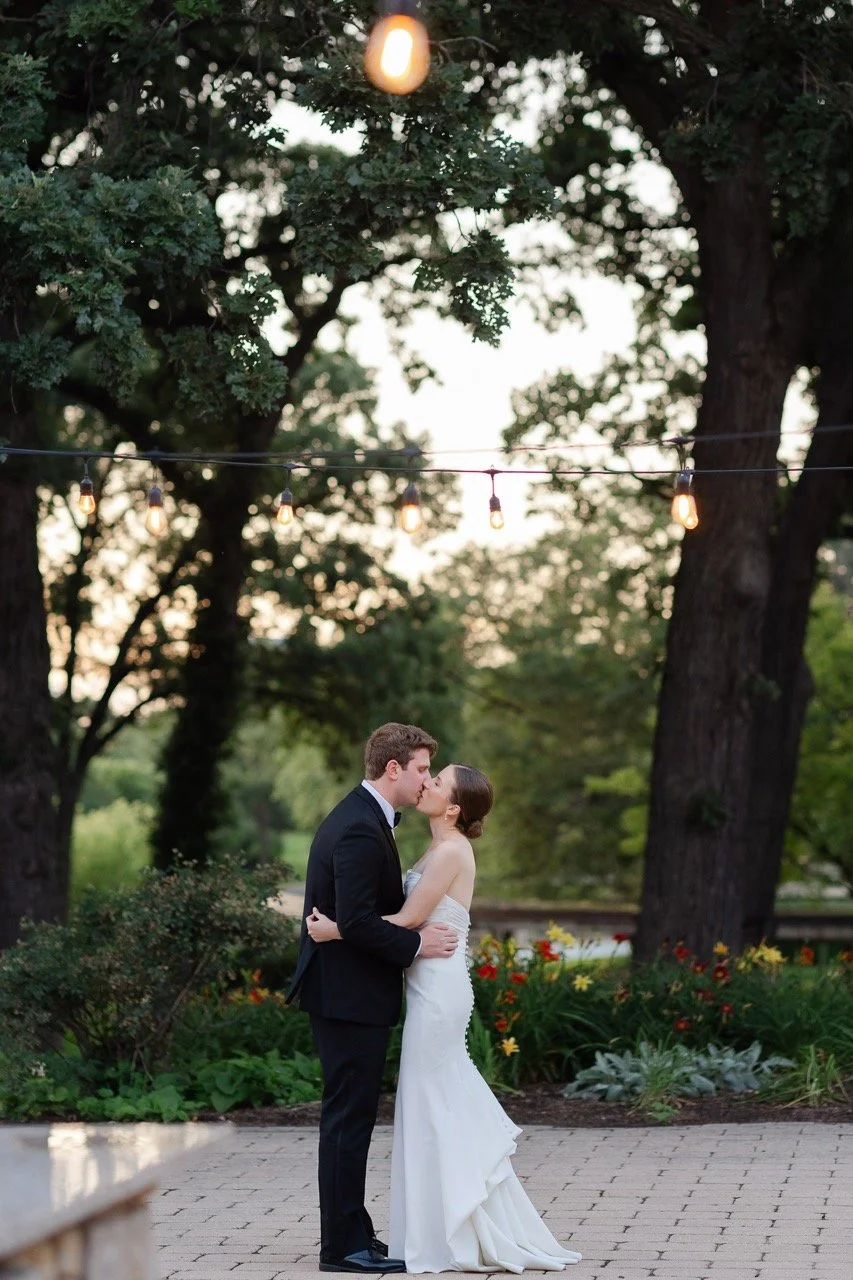 Couple kissing on outdoor patio of Hyatt Lodge Grand Oaks Pavilion