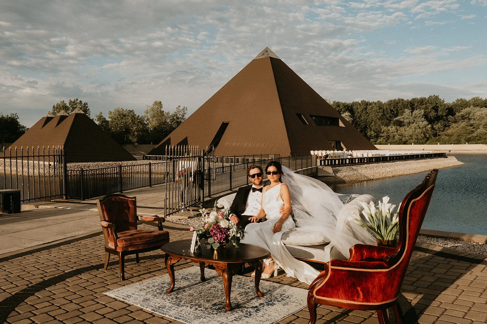 bride and groom sitting on lounge furniture at unique Illinois venue