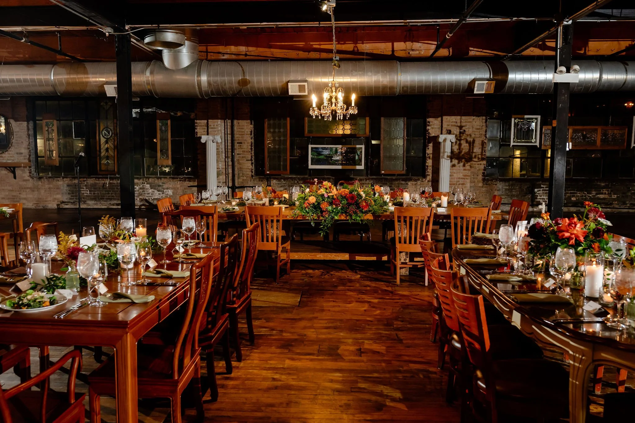 Head table with flowers and candles for wedding reception