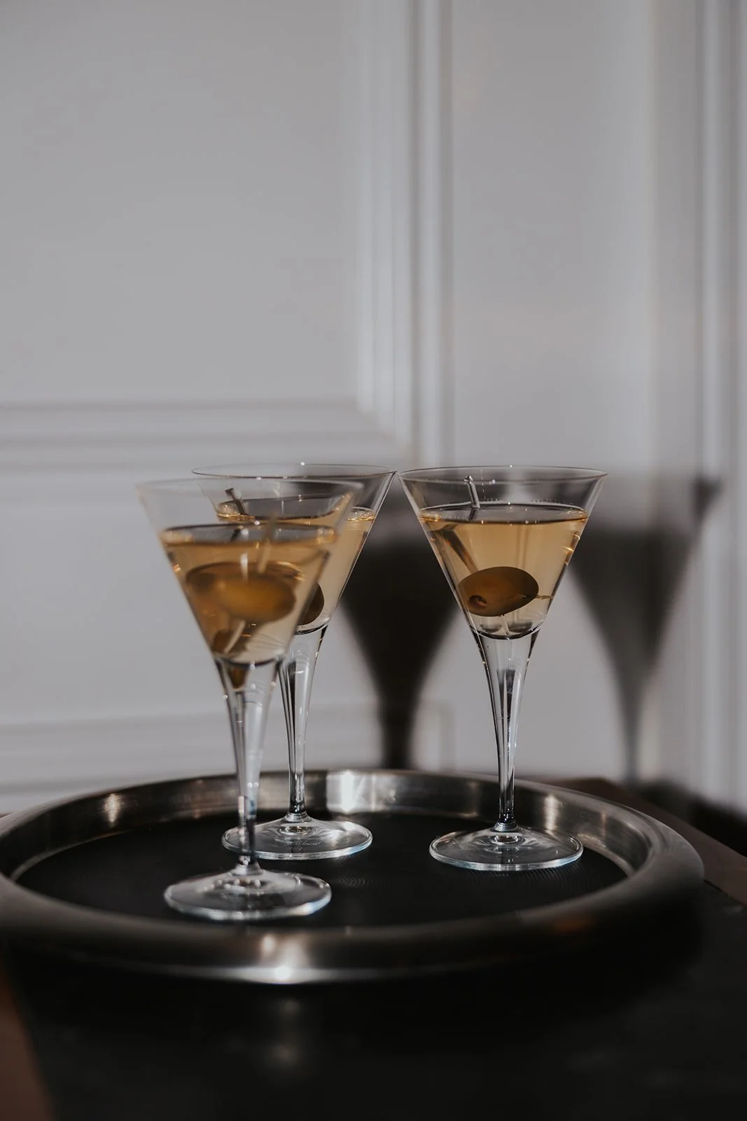 flash photo of 3 martinis on tray