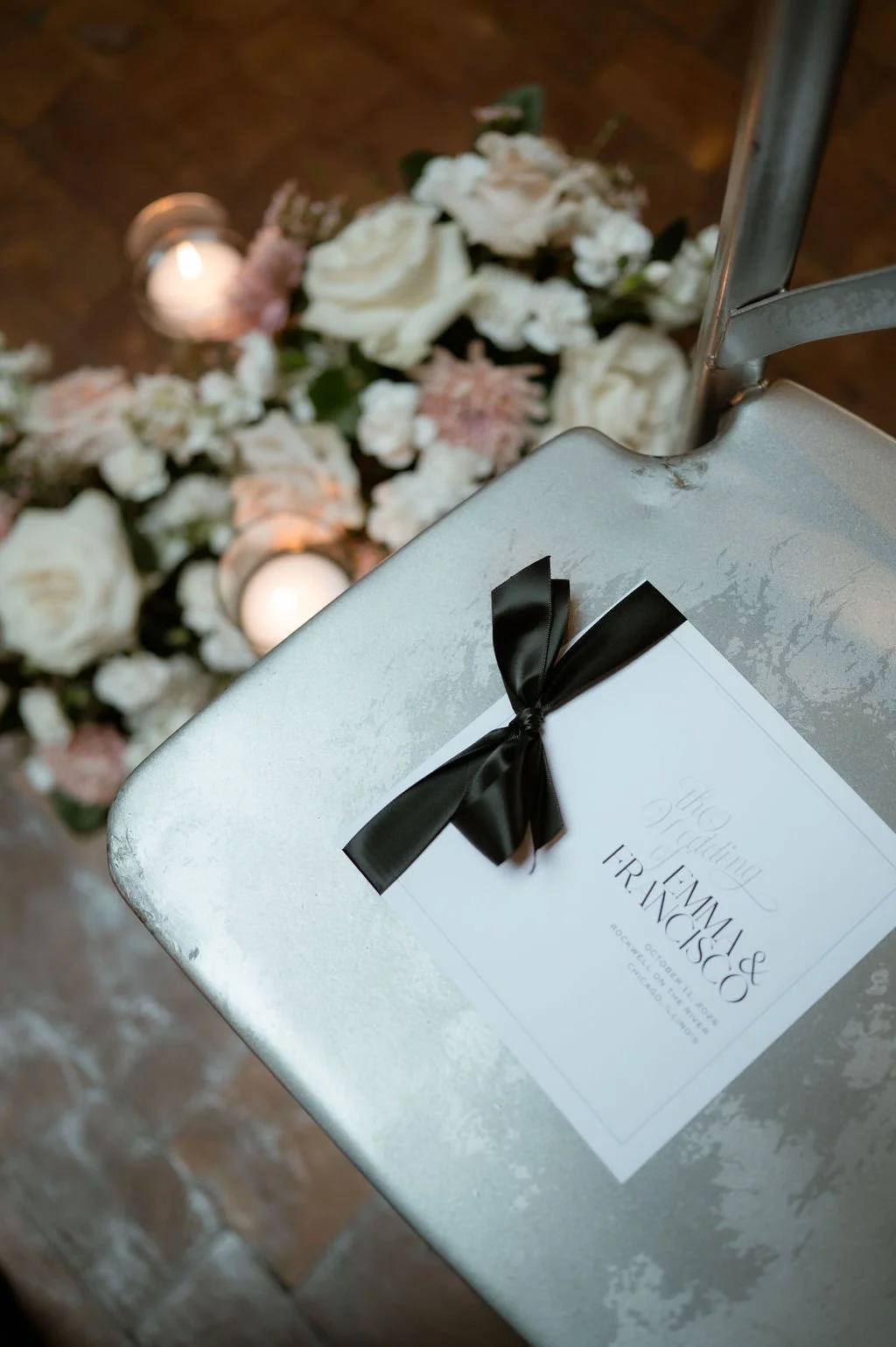 Square wedding program sitting on chair for ceremony