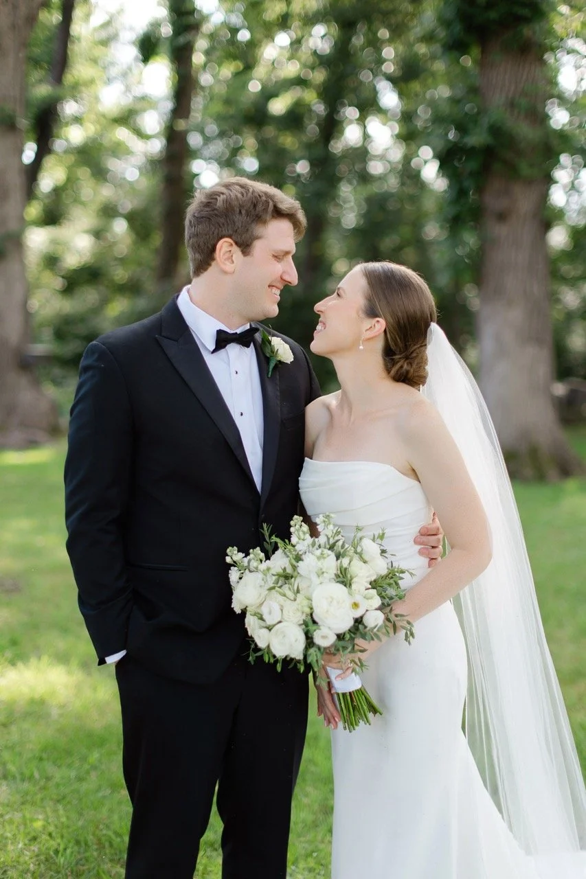 Close up of couple smiling at each other during outdoor couple's photos