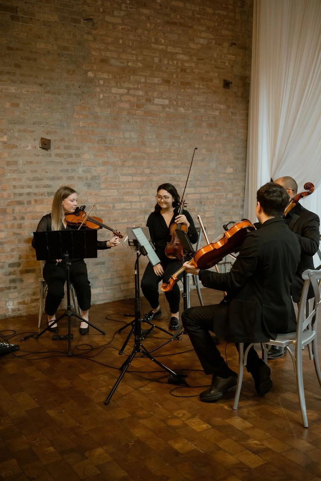ceremony string quartet musicians playing at wedding ceremony
