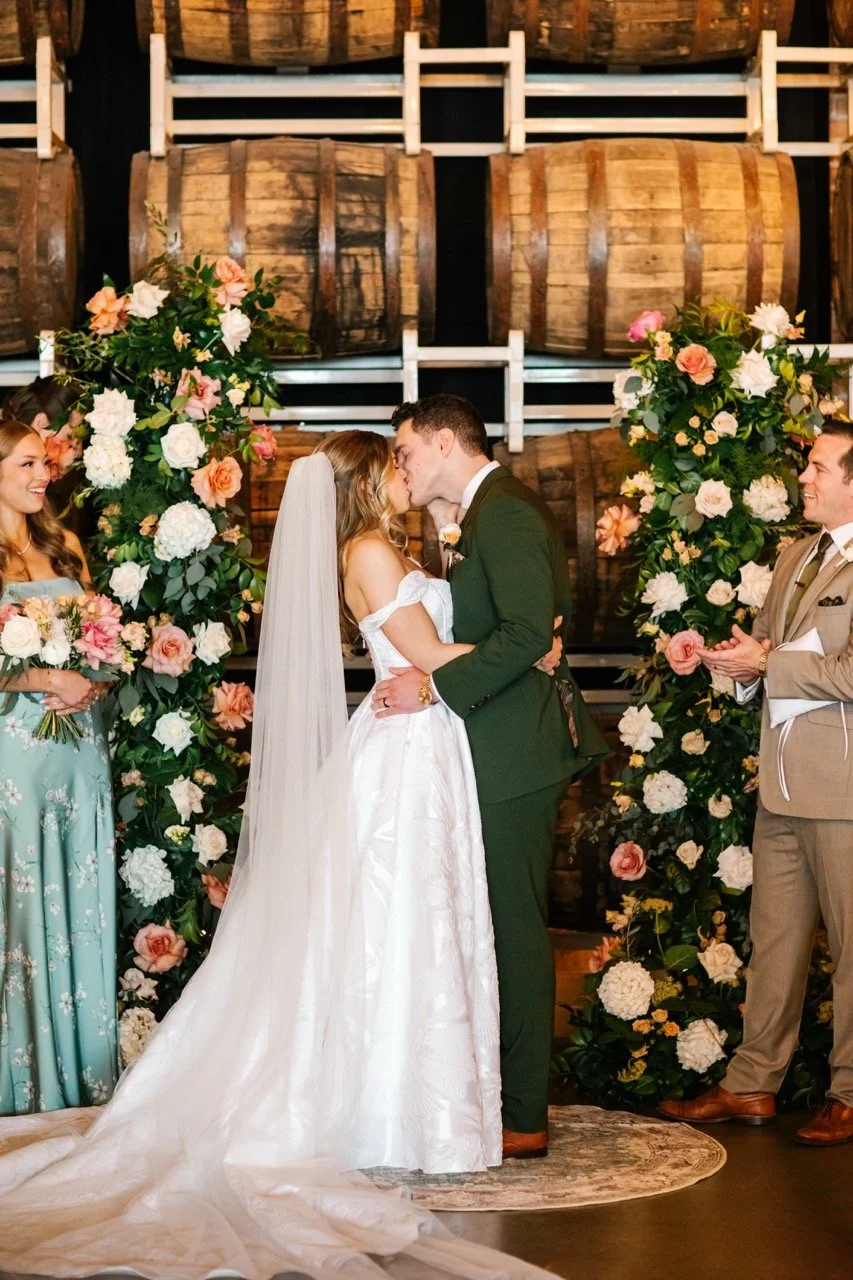 First kiss at wedding ceremony of Goose Island Barrel House