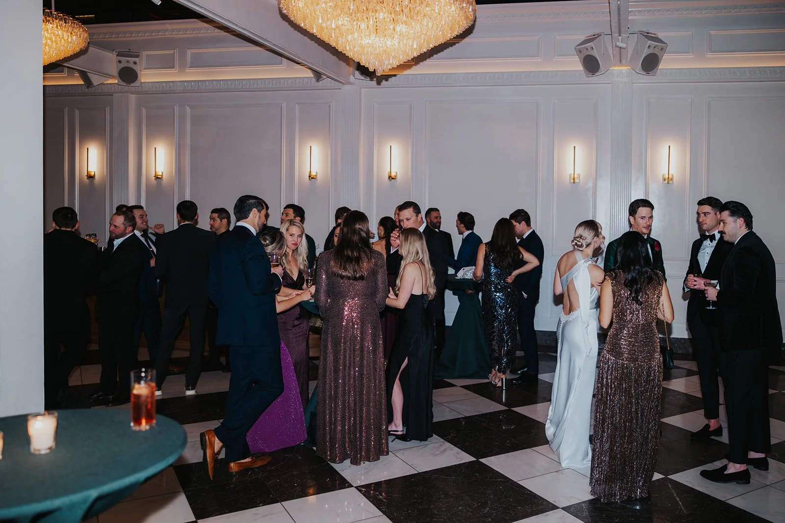 wedding guests mingling with bride and groom wide shot at cocktail hour