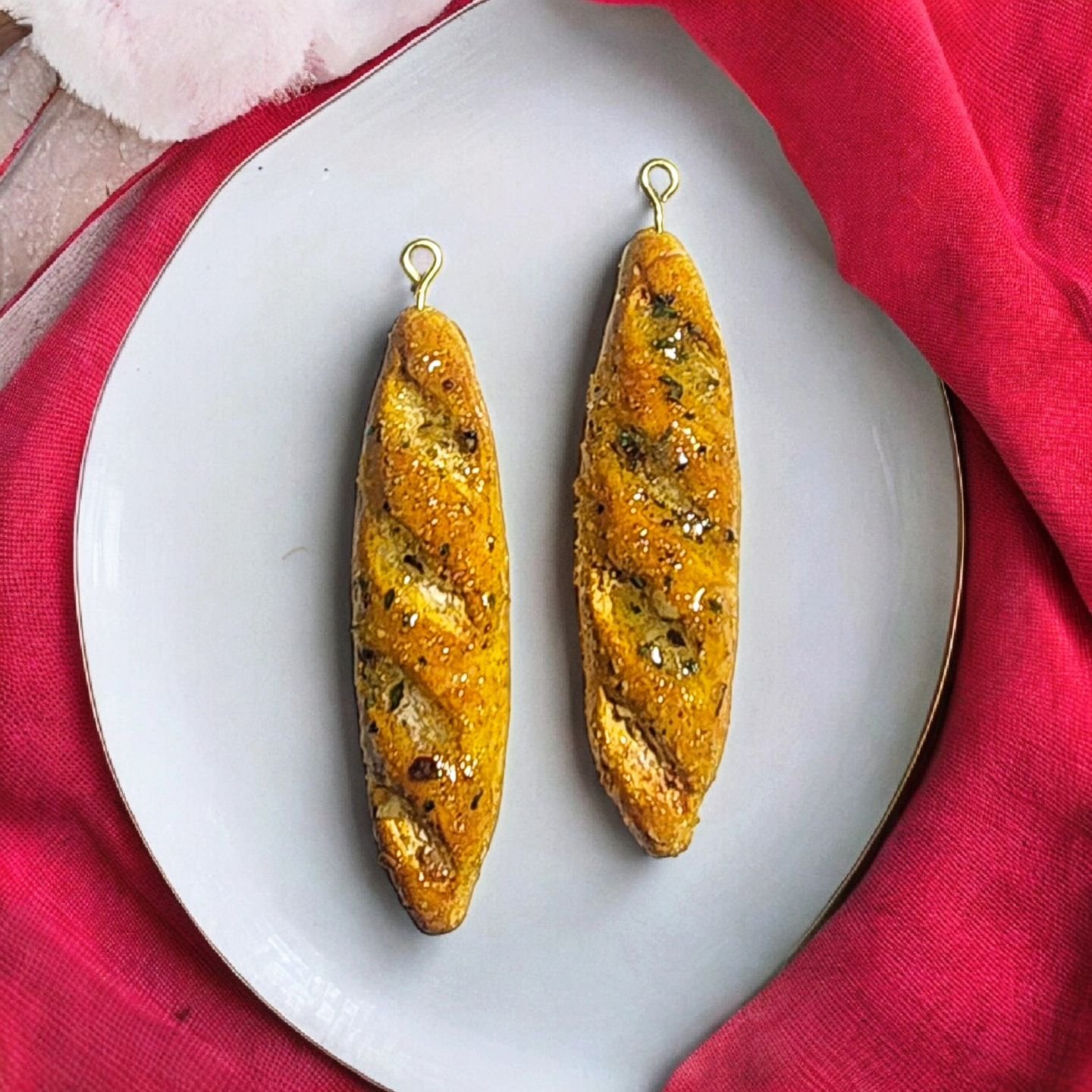 Love this custom order! Buttery garlic bread baguette dangles for a fellow carb lover. 🥖🧈🧄
.
 #terripowerart #handmade  #instaartist #wearableart #polymerclay #clayearrings  #downtowndartmouth #handmadejewelry #polymerclayjewelry #polymerclayearri