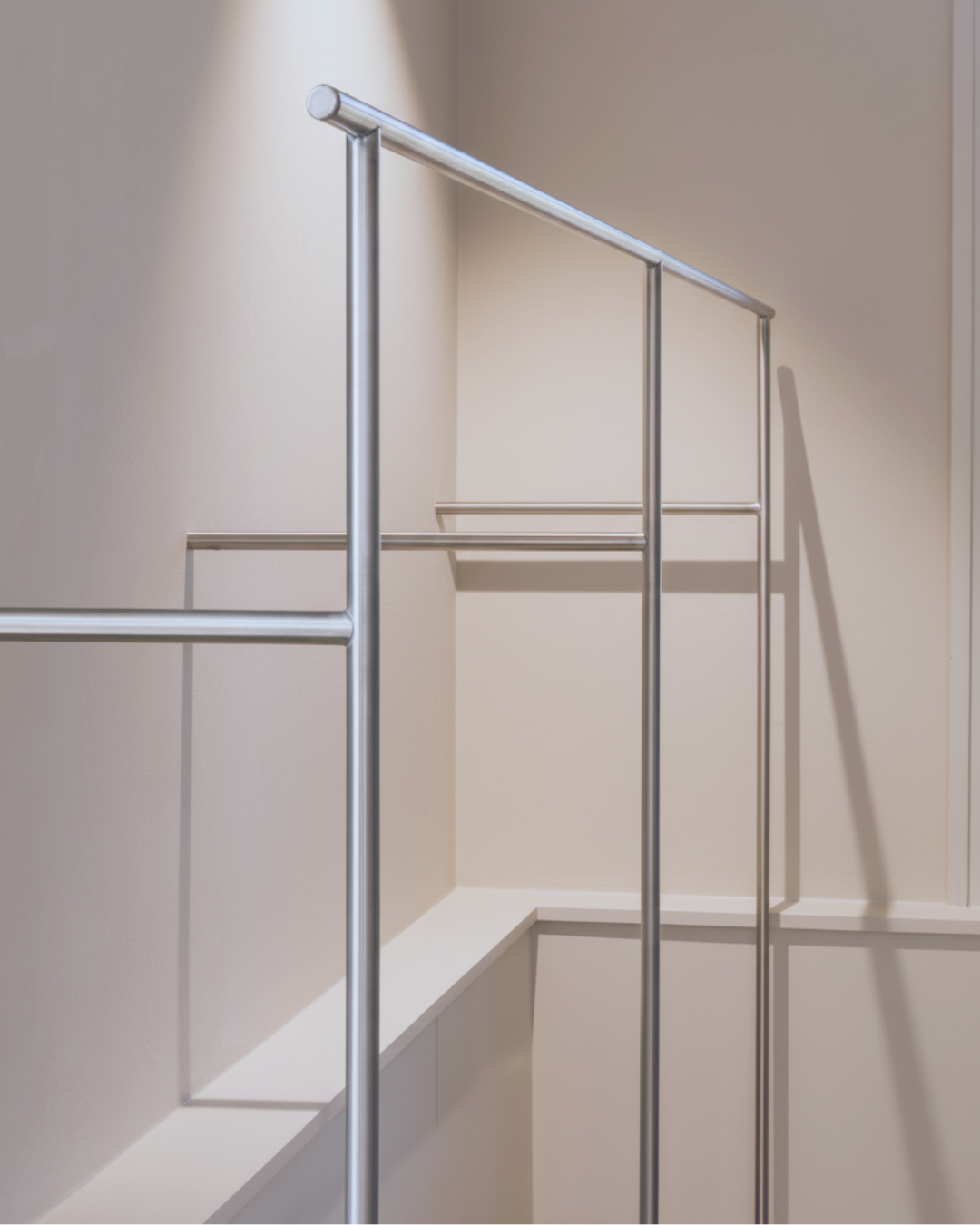 Minimalist steel clothing rail system, Dea Kudibal store