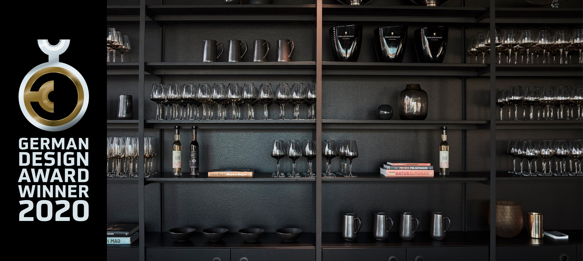 Dark T-profile shelving displaying glassware, BloxEats at Blox, Copenhagen