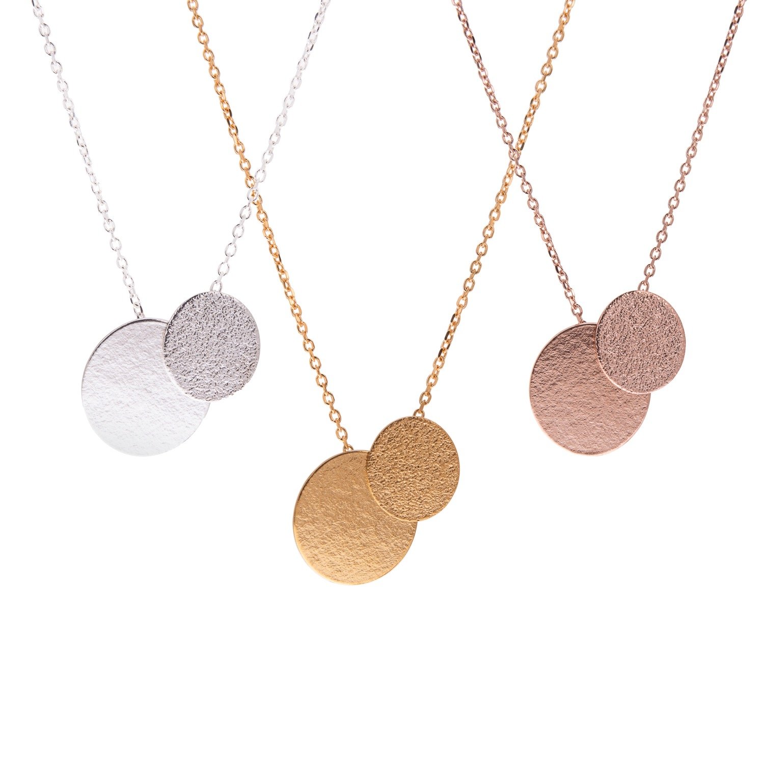 silver rose and yellow gold disc pendants by Lucy Thompson