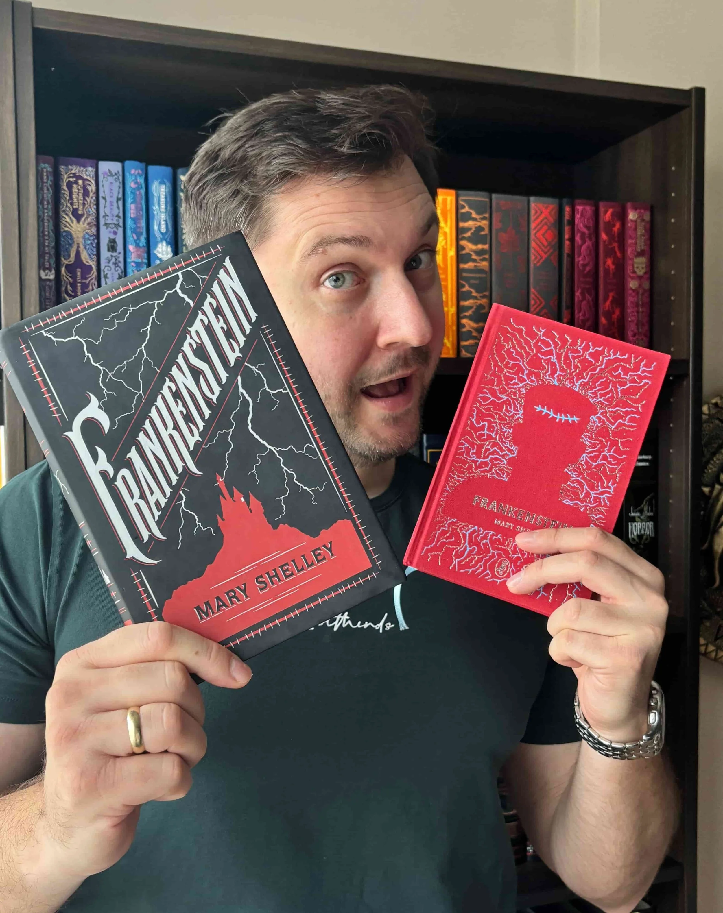 Alex Nikolov of His and Hers Book Club holding two different copies of Frankenstein 2026