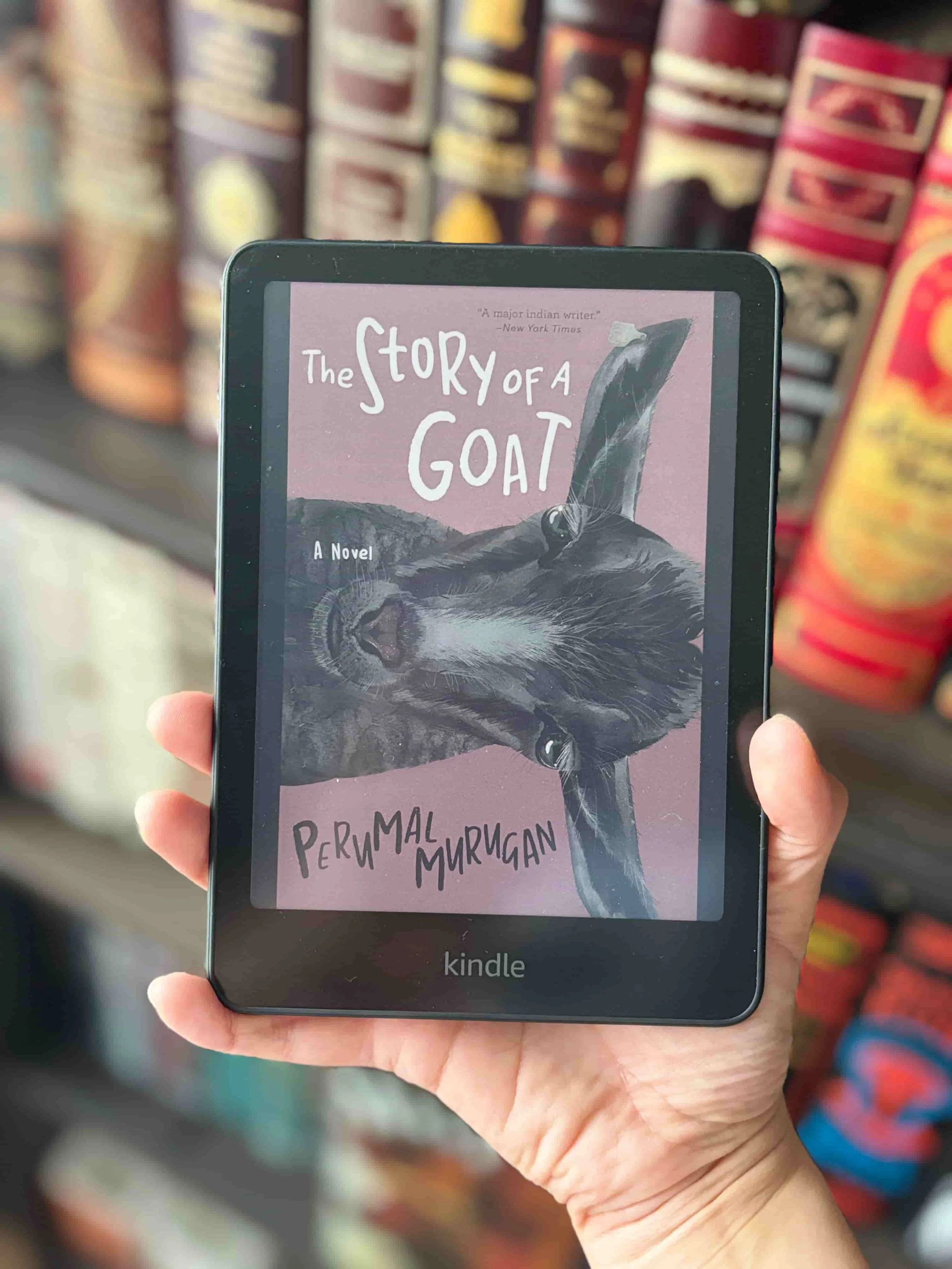The Story of a Goat close up on Kindle held by Stani Ivanova of His and Hers Book Club