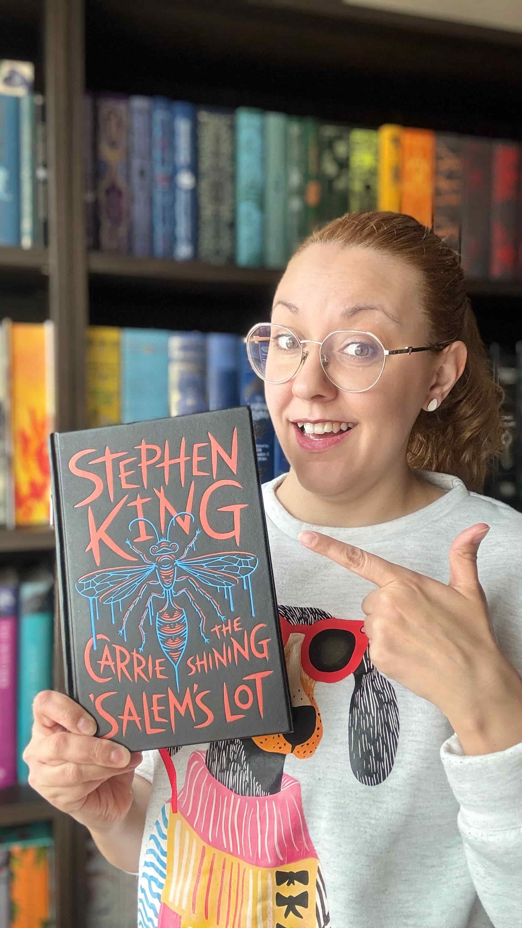 Stani Ivanova of His and Hers Book Club holing the leatherbound edition of Three Novels by Stephen King 2026