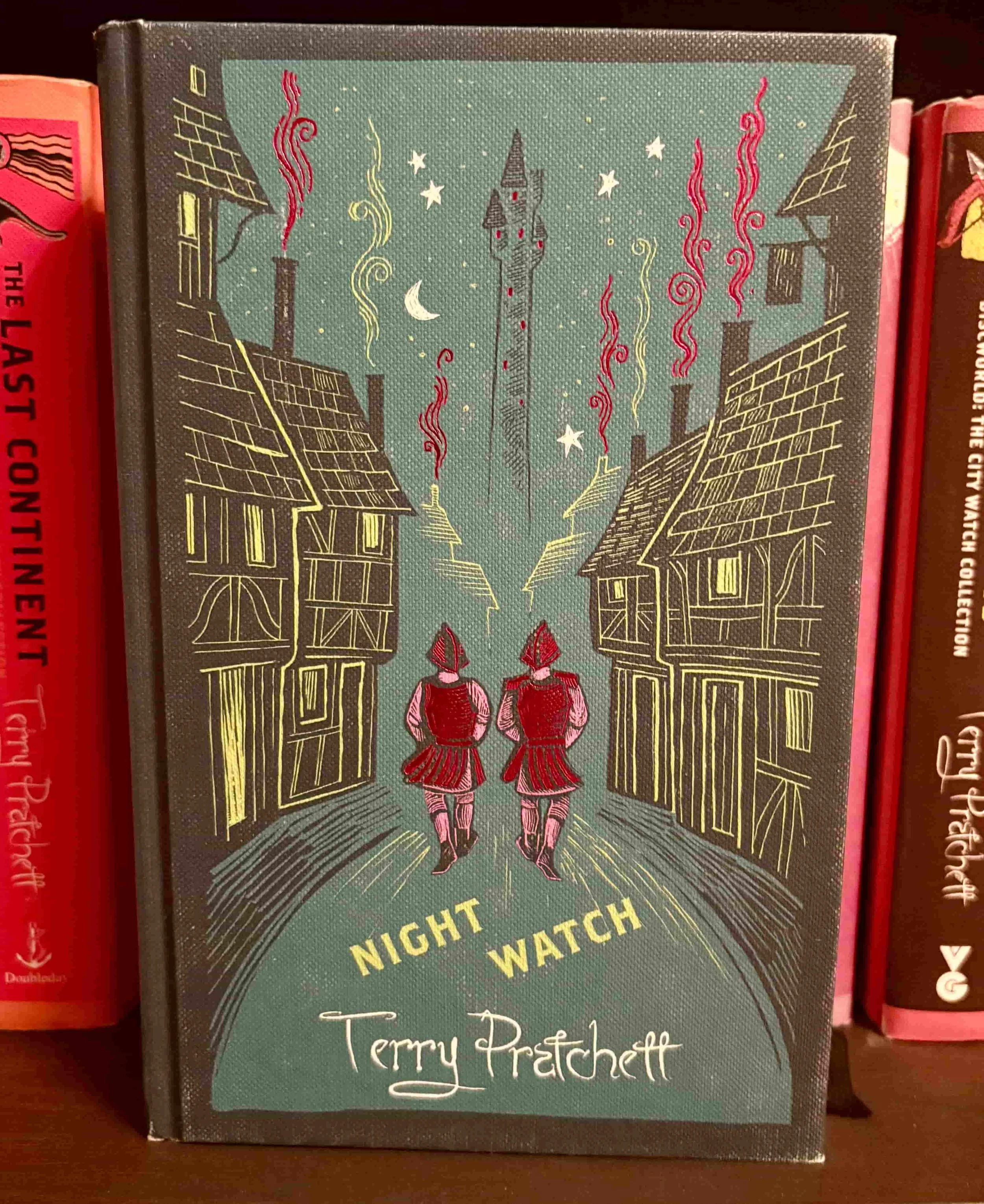The teal cover of Night Watch by Terry Pratchett, featuring the silhouette of a policeman.