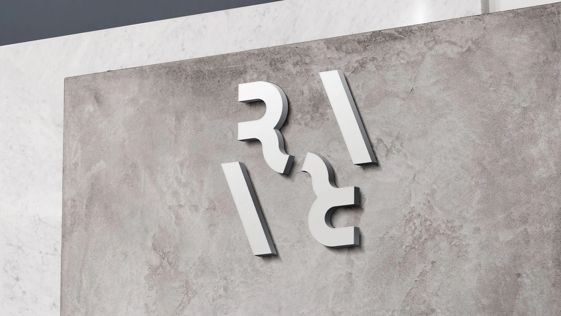 Rara Group corporate brand identity, featuring a dimensional logo mounted on a textured concrete wall.