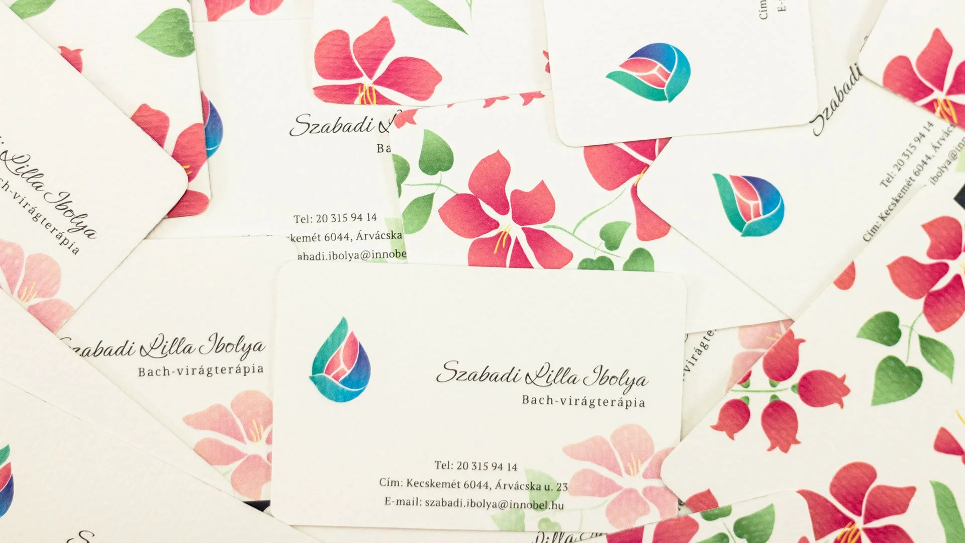Szabadi Lilla Ibolya Bach flower therapy business cards featuring a custom multicoloured droplet and flower petal concept, paired with botanical illustrations.