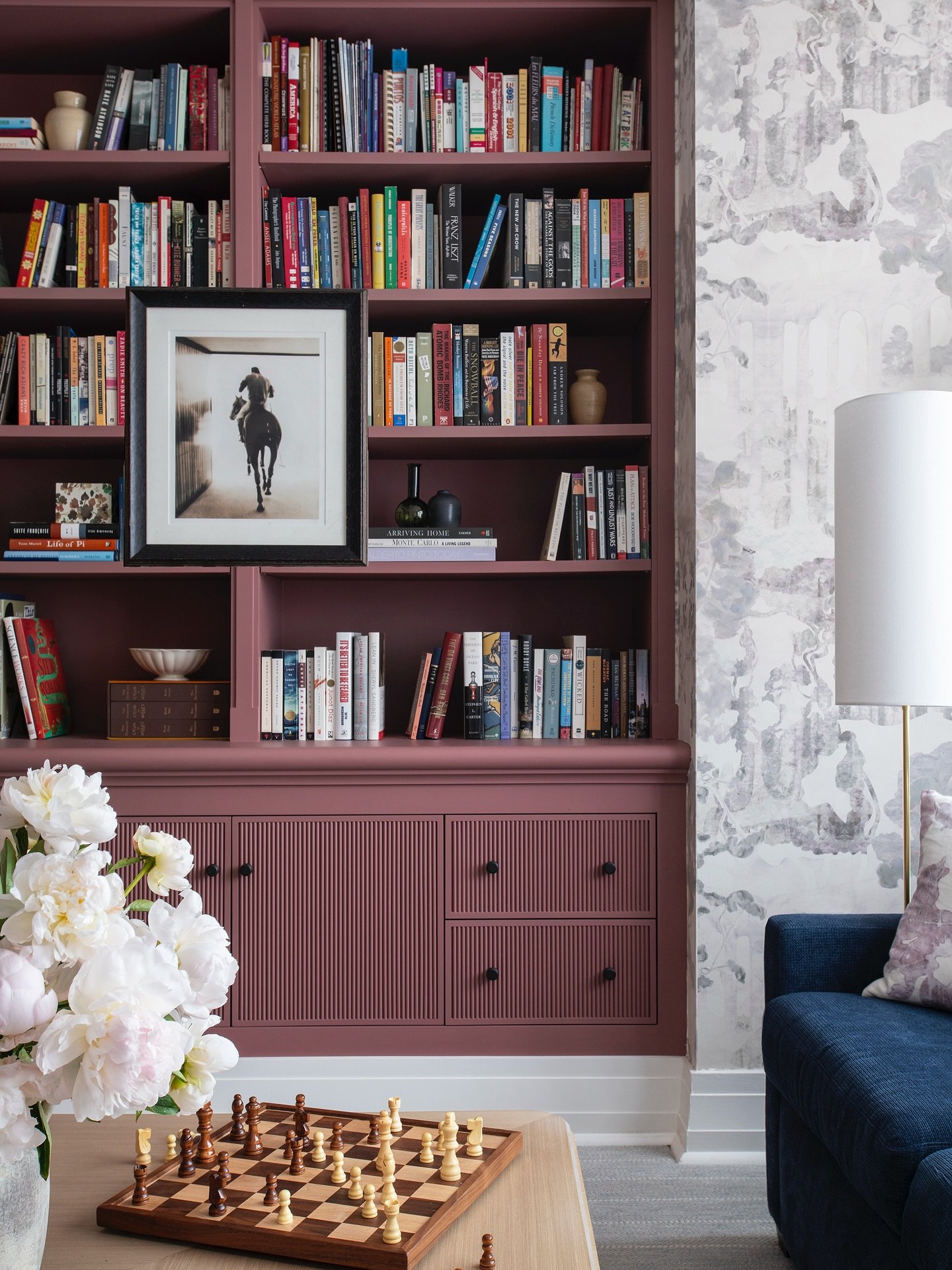 A family room that does it all&hellip; reading nook, game room, and cozy gathering space. ♟️📚

At our Upper East Side project, we layered color, rich textures, and artwork to create a space that feels both inviting and refined. 

Wallpaper: @eskayel