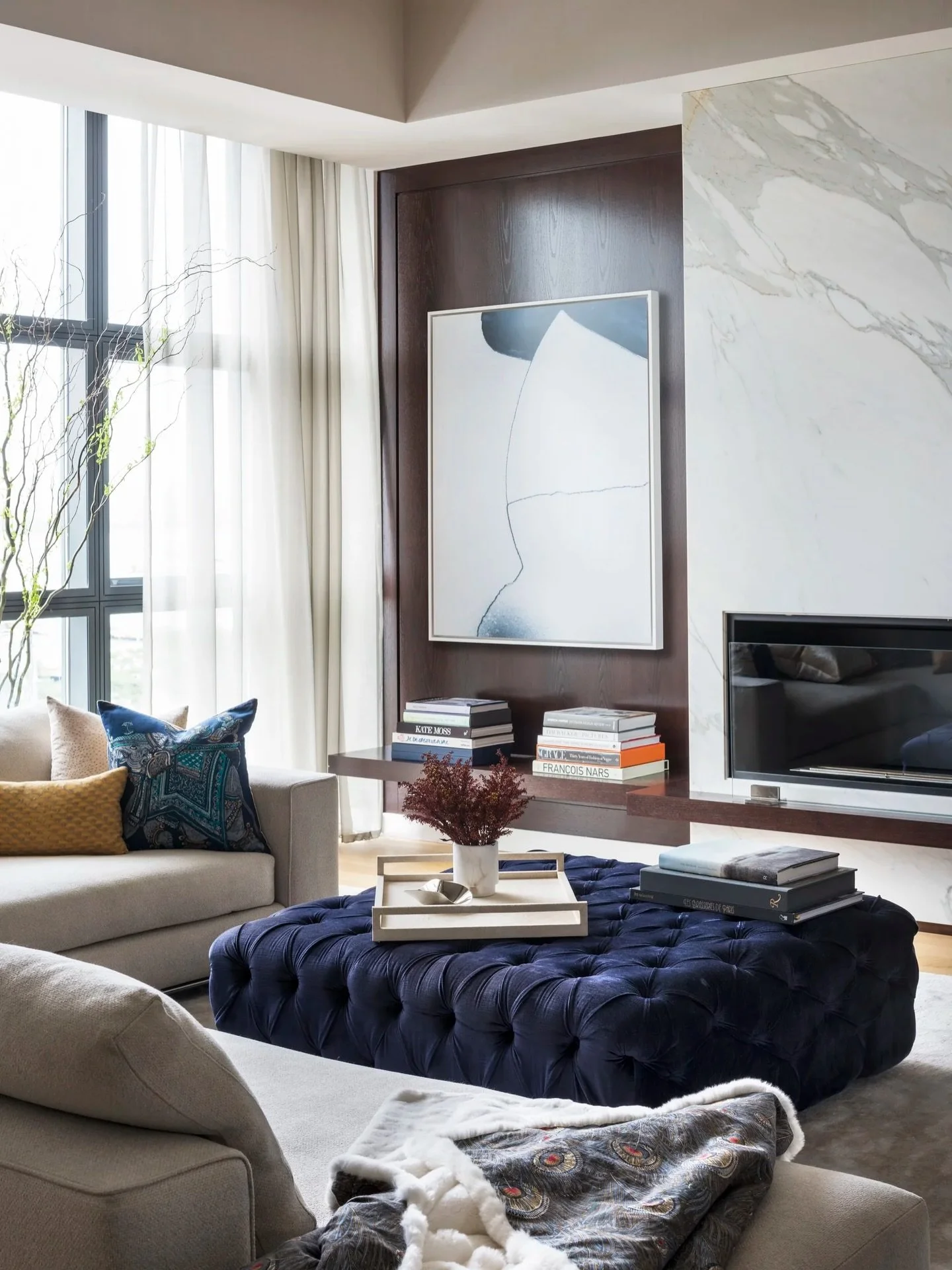 Chic, cozy, and tailored. This Tribeca living room was once a white-box apartment. We introduced warmth and dimension with a marble fireplace, built-ins, and layered seating designed for everyday comfort, elevated. 🔥

Interior design:&nbsp;@ebologni