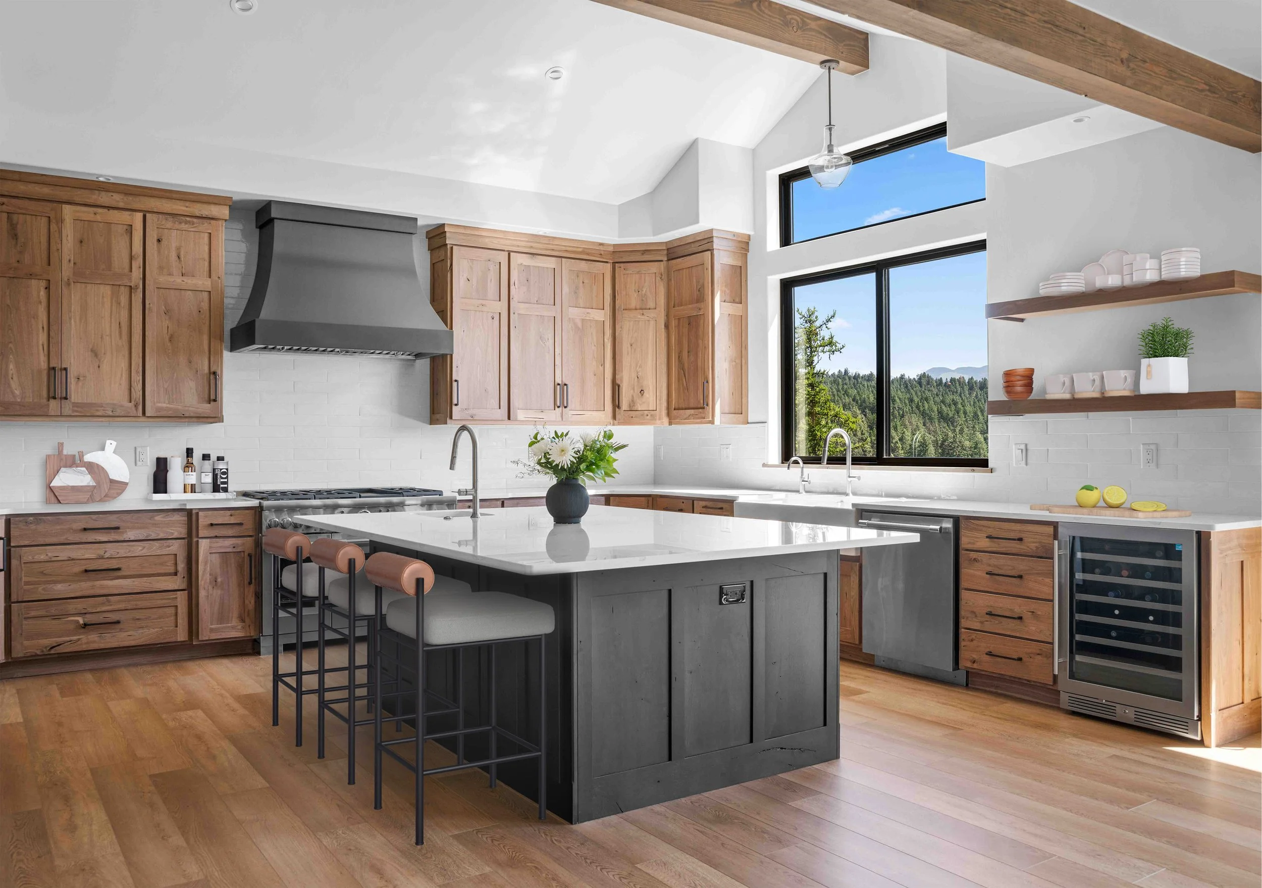 Modern hickory cabinets and weathered wood island adorn a rustic transitional kitchen in Bigfork, Montana.