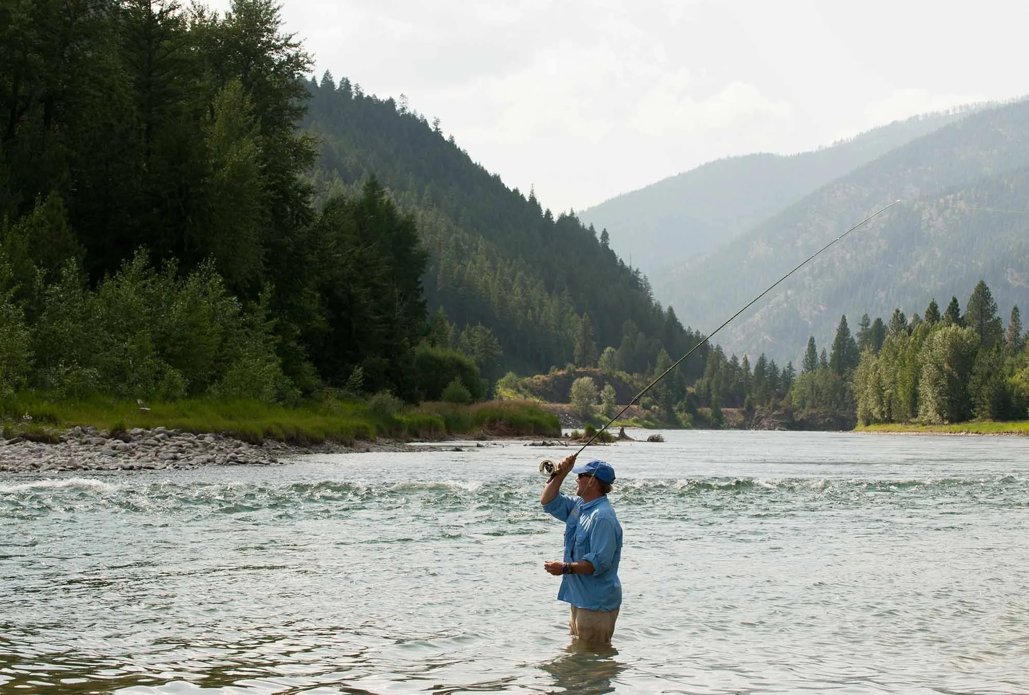 Man fly fishing on Middle Fork of the Flathead River near Columbia Falls, Montana
