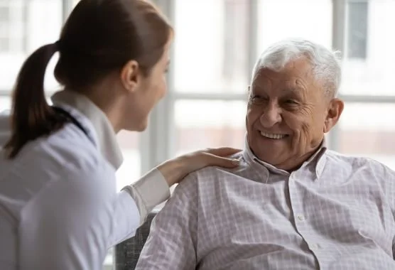 abbp-smiling-elderly-man-with-caretaker.jpg