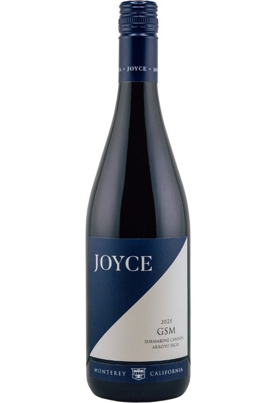 A wine bottle with navy and white diagonal design, displaying the name 'Joyce' and the logo for GSM Arroyo Seco.