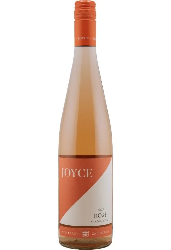 Wine bottle with a pink and white diagonal design, displaying the name 'Joyce Rosé Arroyo Seco' and a crest emblem.