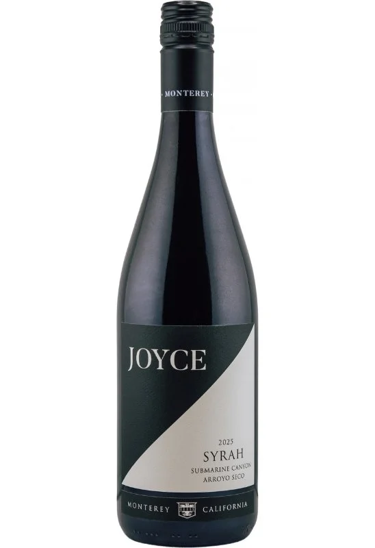 A wine bottle with black and white diagonal split background with the text 'Joyce' in large white letters on the black side, and a logo with the text 'Syrah Arroyo Seco' on the white side.