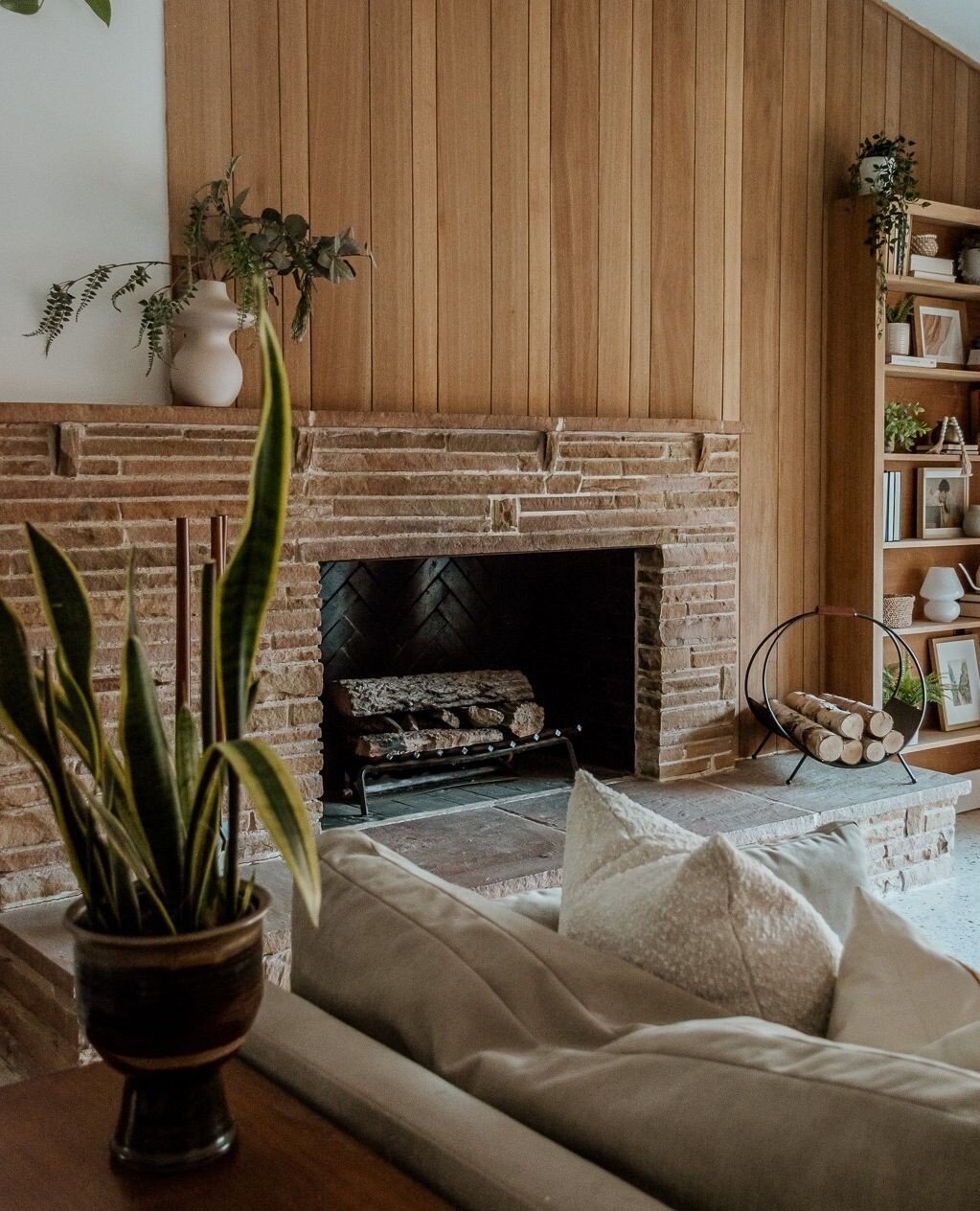 Bringing back the soul of this mid-century gem! ✨ Swipe to see the before to truly appreciate the stunning transformation of this living room, where we unveiled the timeless beauty of mahogany wood paneling beneath layers of paint. ⁠
⁠
From dull to d