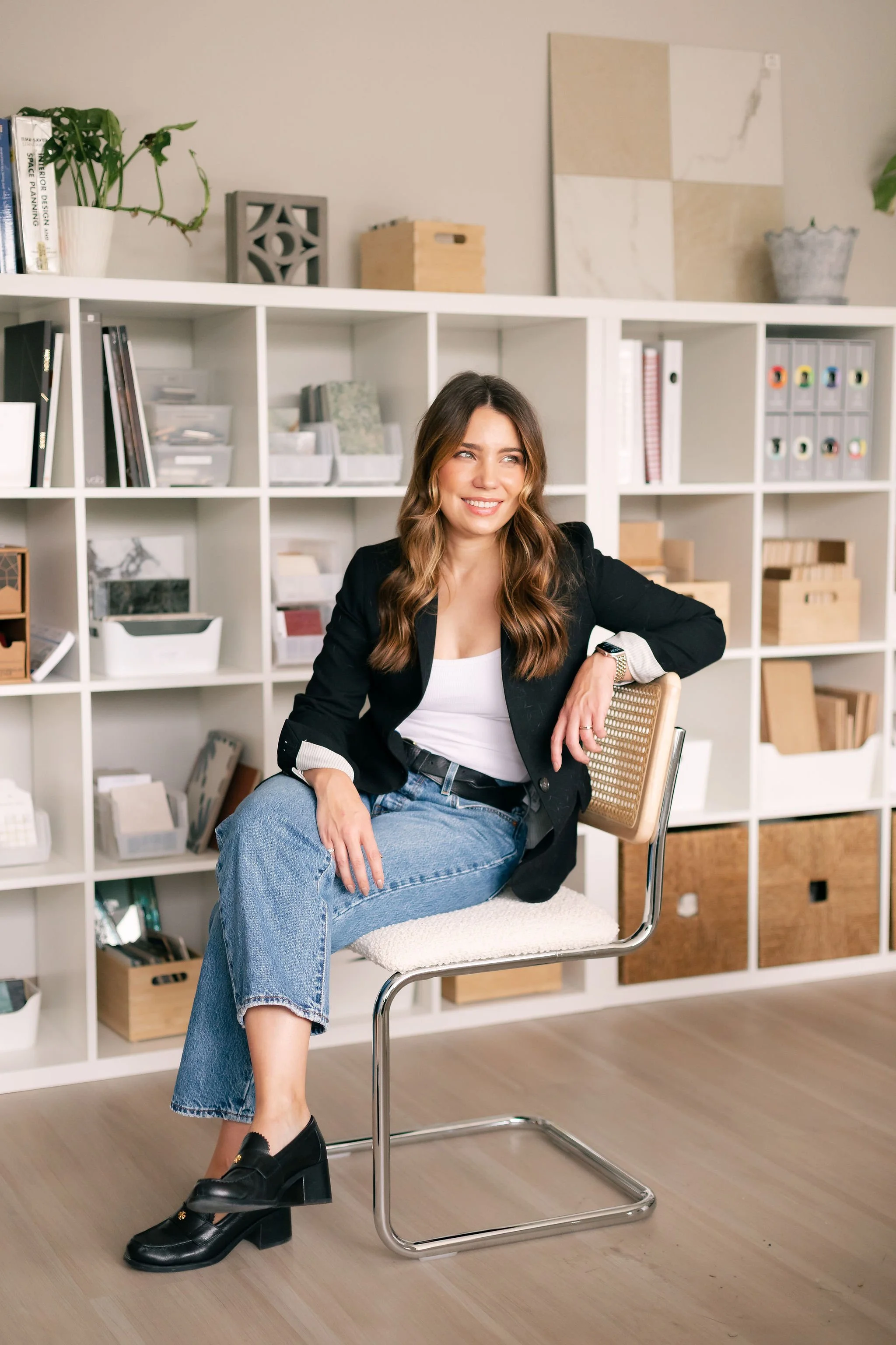 Courtney Batten, founder and principal designer of Paige Studio, seated in her Dallas interior design studio.