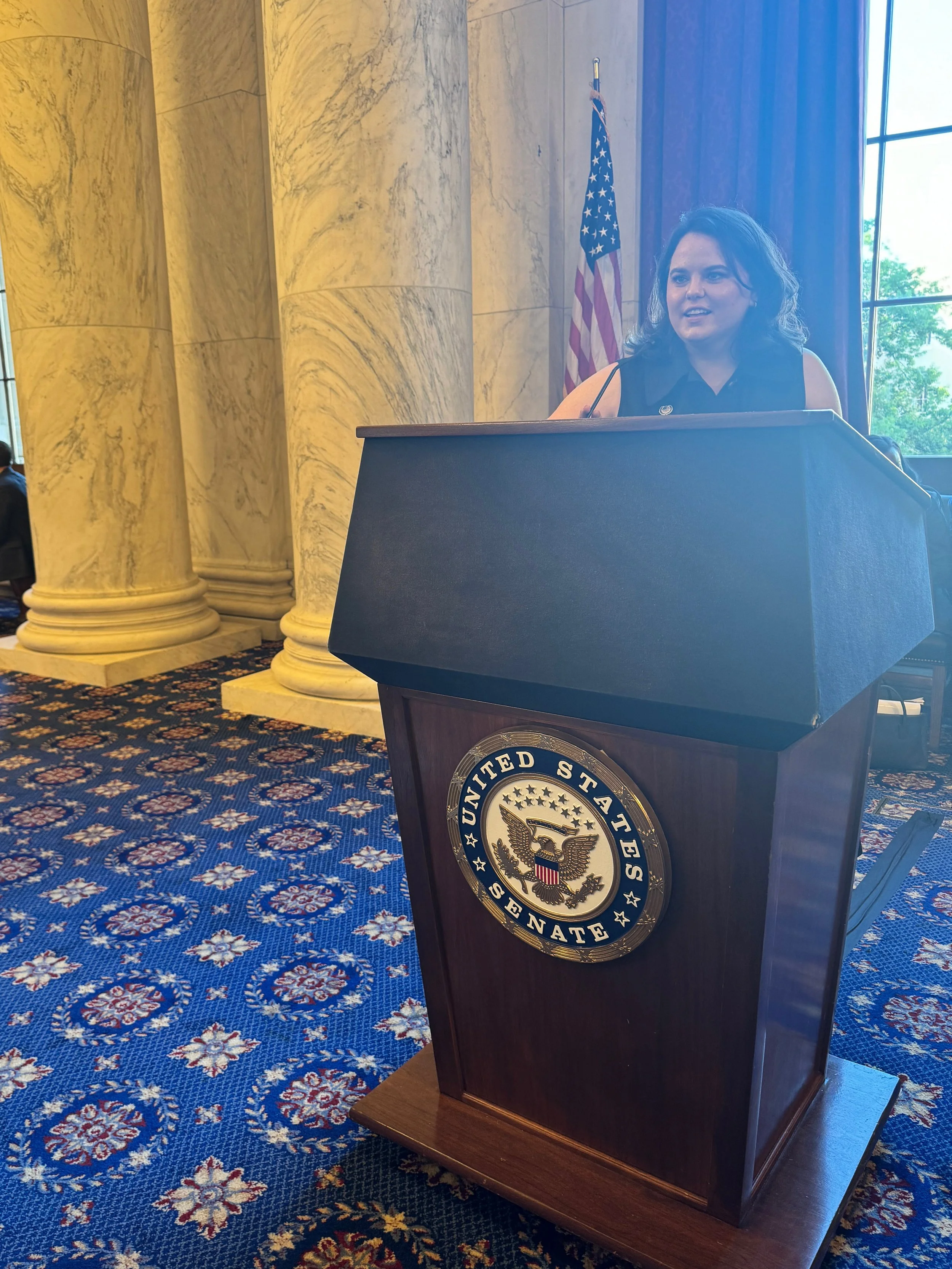 Woman standing at United States Senate Podium