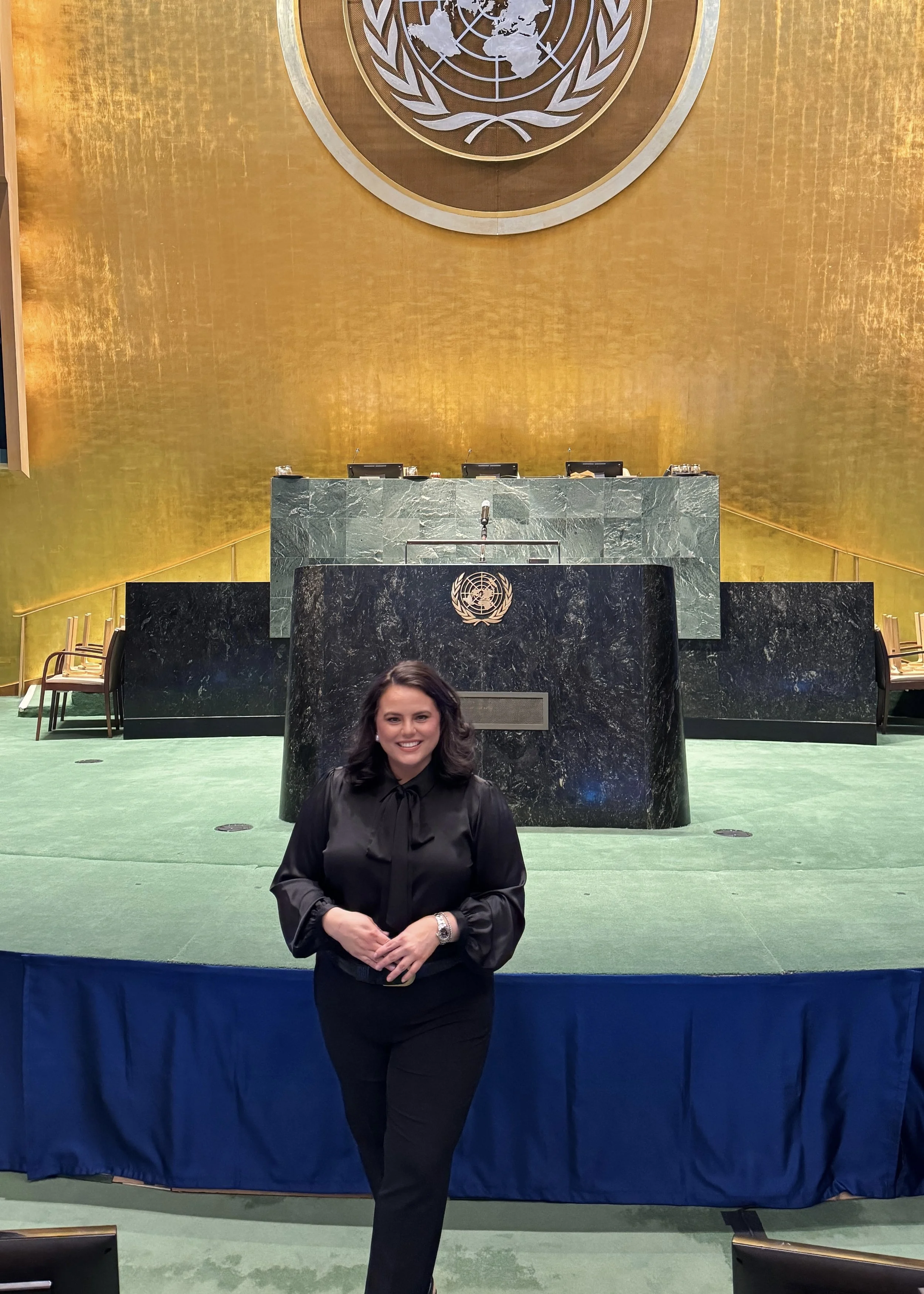 Woman standing at front of United Nations General Assembly Hall
