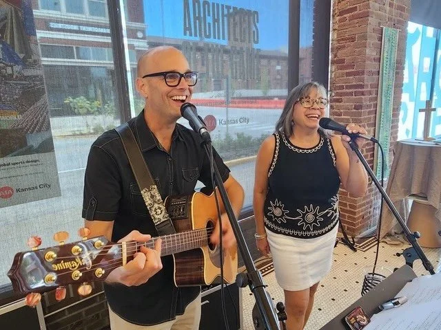 Music leaders Alex and Eli singing on Sunday morning