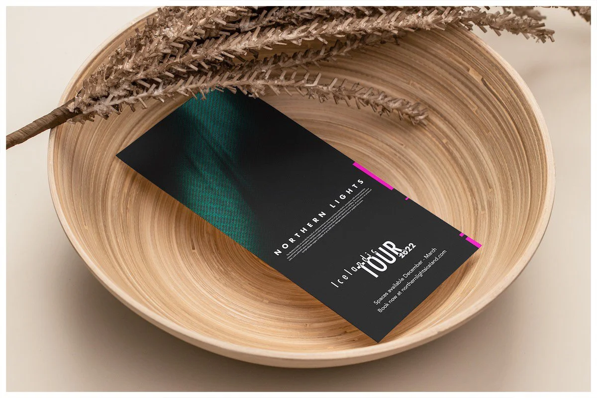 A flyer mockup using a design showcasing Aurora Borealis (Northern Lights) with a minimalism approach. Poster design by Carmelo Rossette.