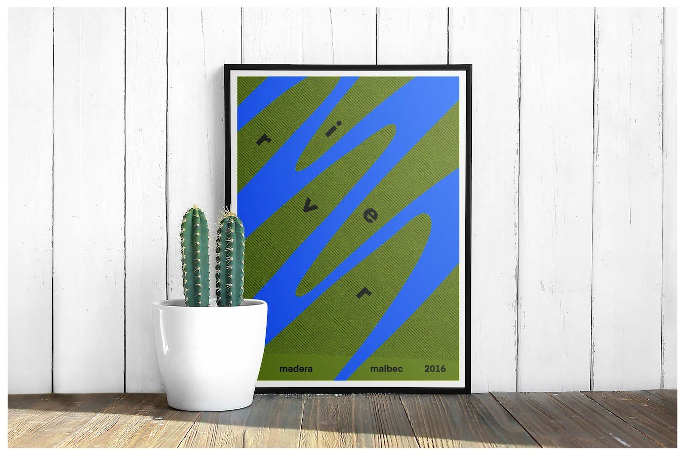 A poster mockup using a design showcasing the fictitious business of River Wines with a minimalism approach. Poster design by Carmelo Rossette.