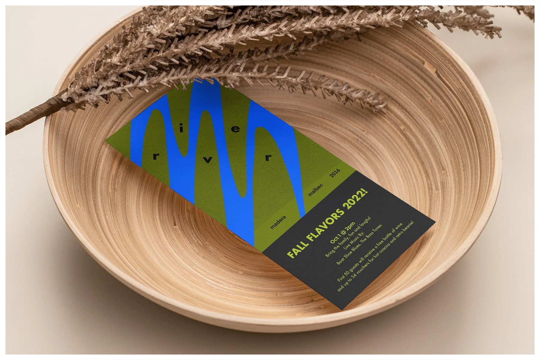 A flyer mockup using a design showcasing the fictitious business of River Wines with a minimalism approach. Poster design by Carmelo Rossette.