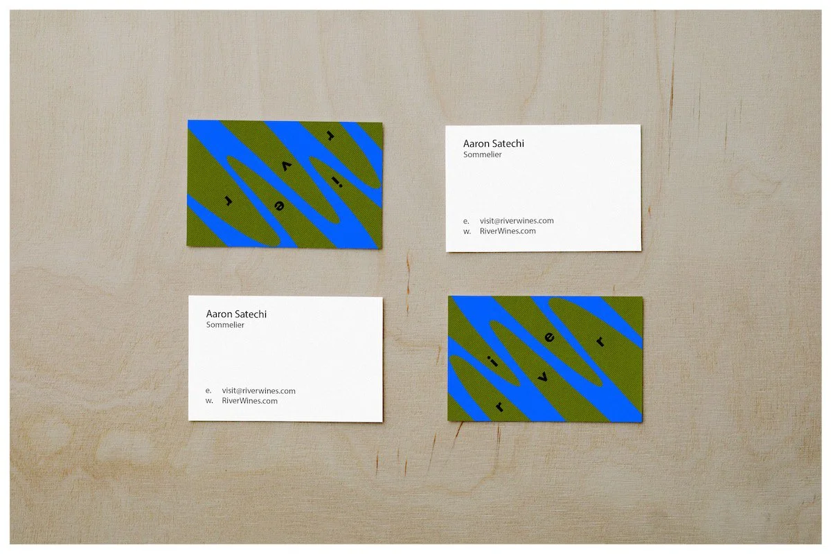 Business card mockups using a design showcasing the fictitious business of River Wines with a minimalism approach. Poster design by Carmelo Rossette.