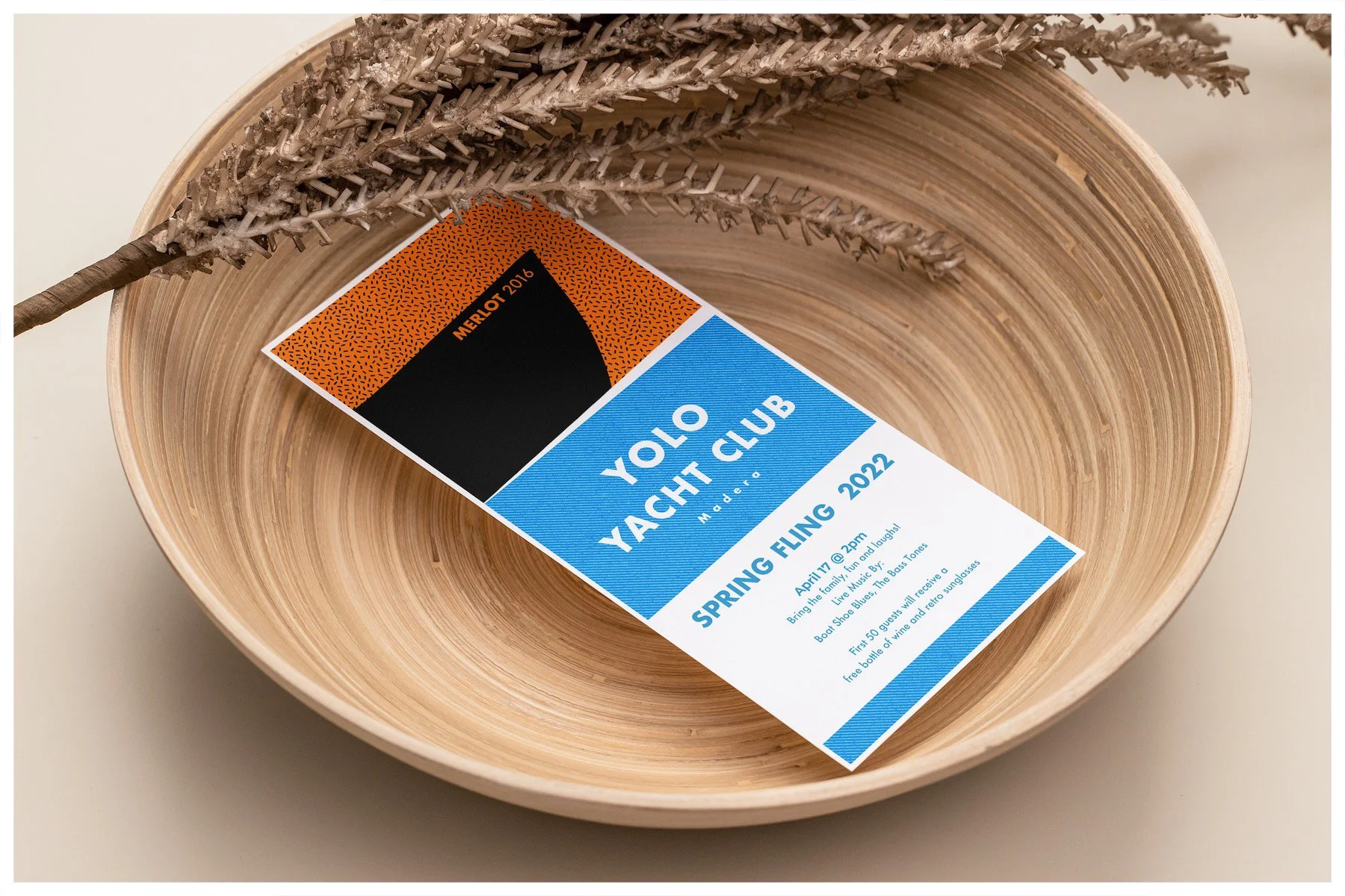 A flyer mockup using a design showcasing the fictitious company Yolo Yacht Club Wines with a minimalism approach. Poster design by Carmelo Rossette.