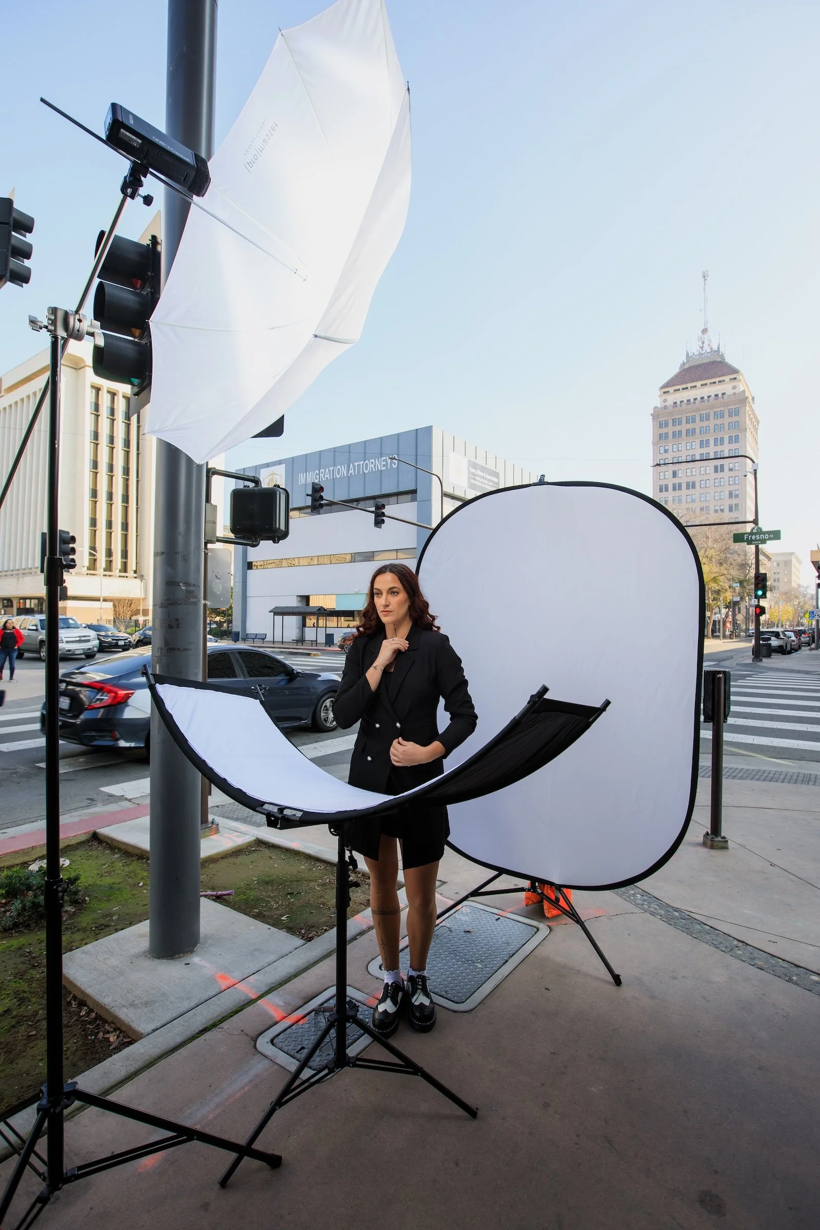 A professional Headshot photograph of a woman getting her professional headshot taken in Downtown Fresno.