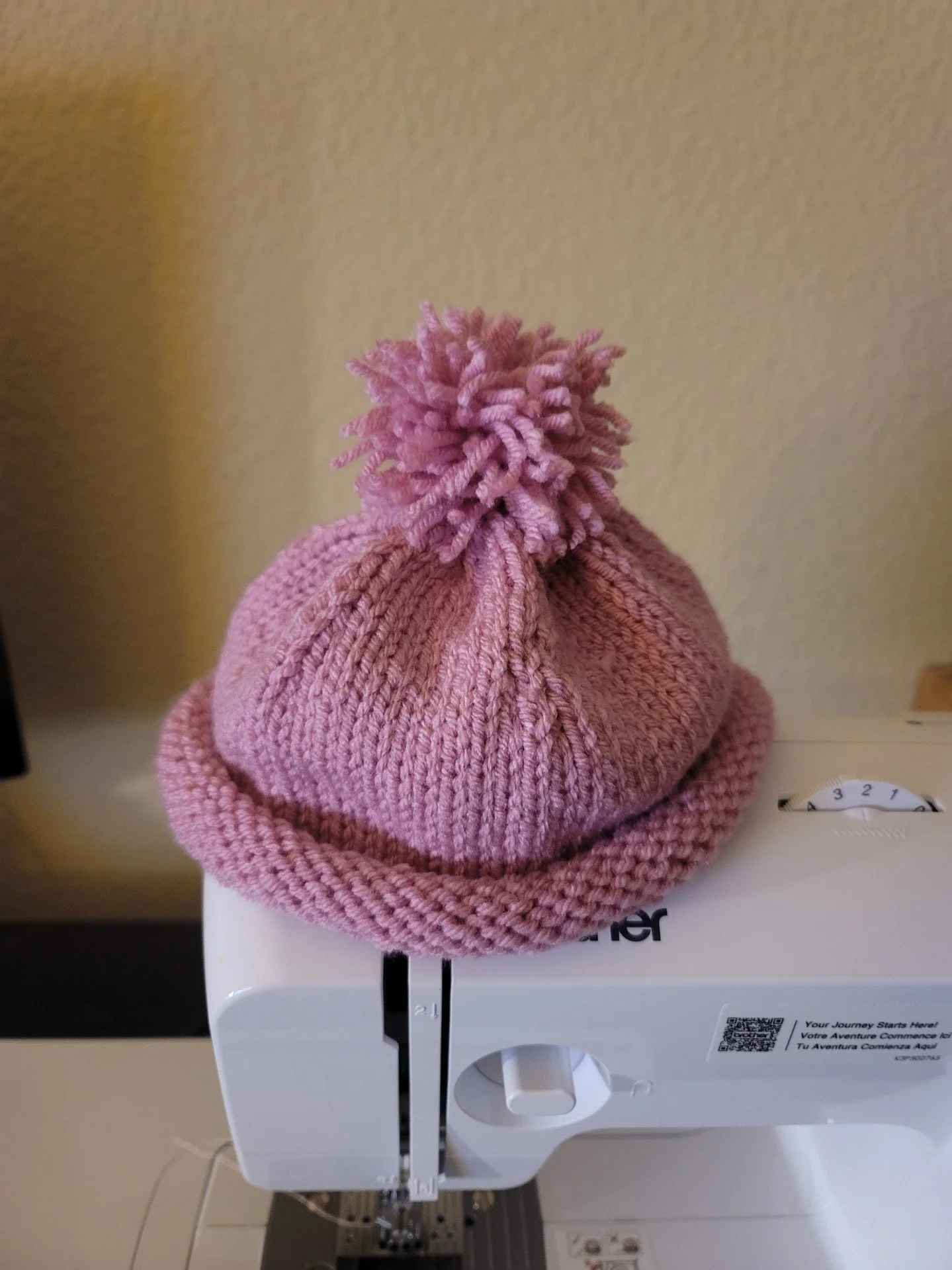 Wow! 🌟🧶🎩 This student's finished hat 🎉👏 Such talent and dedication! Love the handmade pom pom too! Keep up the great work! #knitting #handmade #proudteacher