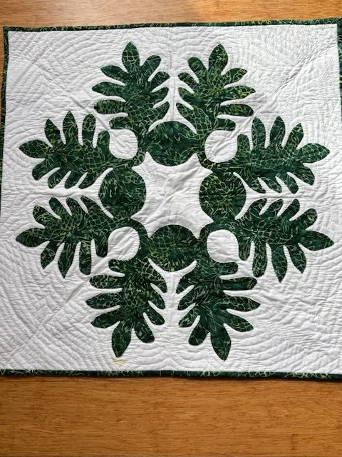 Wow, Gail's finished Kapa project is absolutely stunning! 🌺🌿🧵 I'm so proud of her hard work and dedication. #quiltart #hawaiianquilting