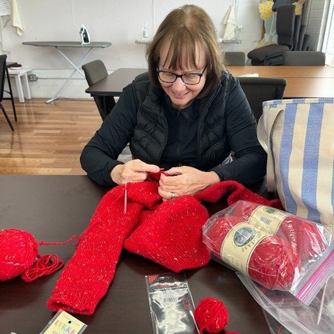 Thirty years ago, Kathy cast on a red sweater for her niece.
Life got busy. The sweater got folded away. And like so many creative projects, it waited quietly.
In 2025, Kathy decided it was time.
She came back to knitting. We refreshed the basics. Sh