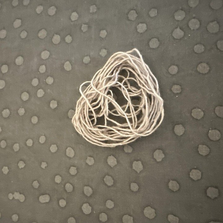 Proof that I played extreme yarn chicken&hellip; and won. 🐔🧶
This tiny leftover is all that remained after binding off my project&mdash;my heart was pounding those last few rows! Have you ever cut it this close on a knit or crochet project?
#YarnCh