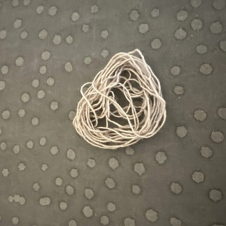 Proof that I played extreme yarn chicken&hellip; and won. 🐔🧶
This tiny leftover is all that remained after binding off my project&mdash;my heart was pounding those last few rows! Have you ever cut it this close on a knit or crochet project?
#YarnCh