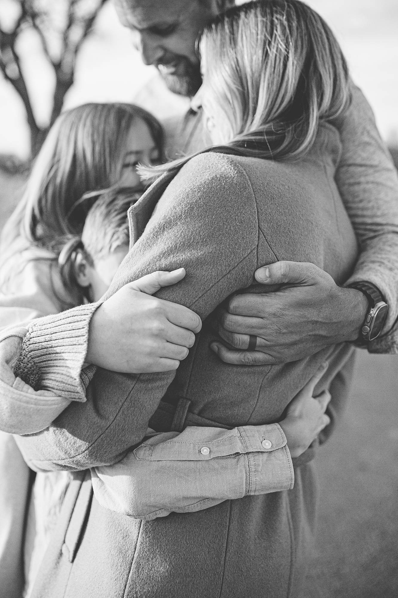 candid family photo hug with hands