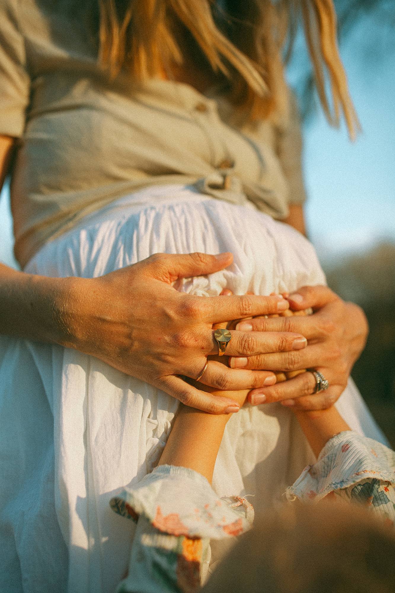 maternity photo session kid hands on mom's tummy